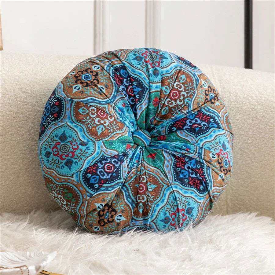 Handmade Boho round thick floor cushion with elegant center button design in a colorful pattern.
