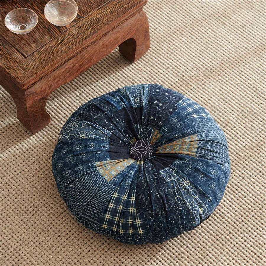 Handmade Boho Round Thick Floor Cushion with central button design in dark blue pattern on carpet.