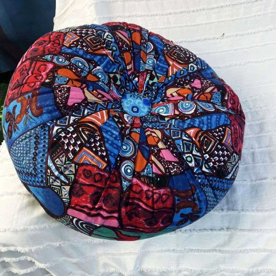 Handmade Boho Round Thick Floor Cushion with vibrant colors and central button design.