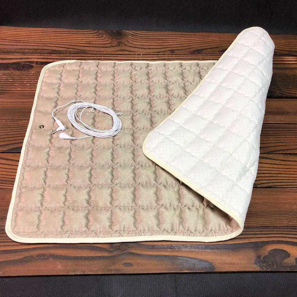 Earthing Silver Pad for EMF protection, conductive grounding mat on a wooden surface with grounding cable included.