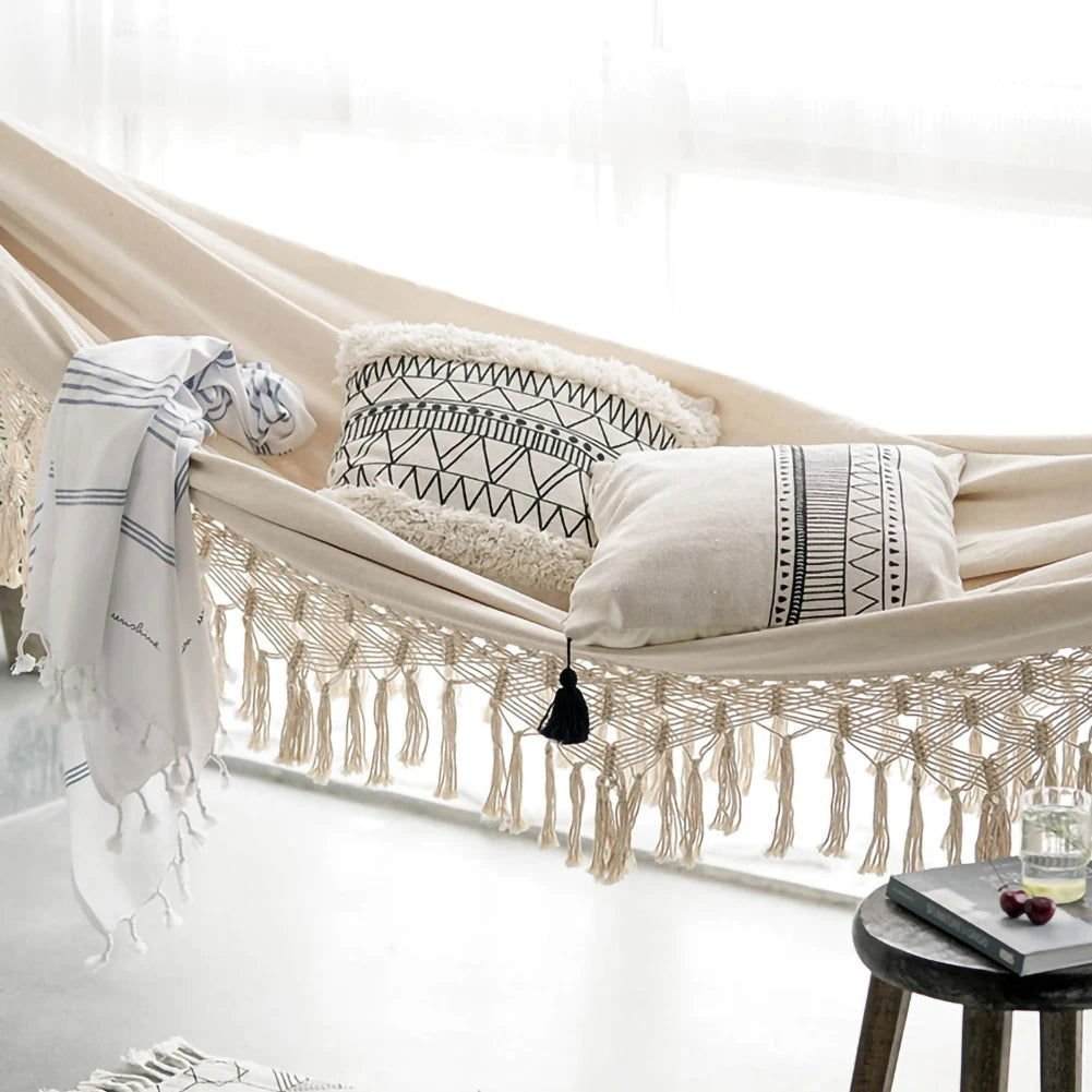 Brazilian macramé bohemian two-person hammock with tassels and pillows, supports up to 450 lbs, elegant and durable fabrication.