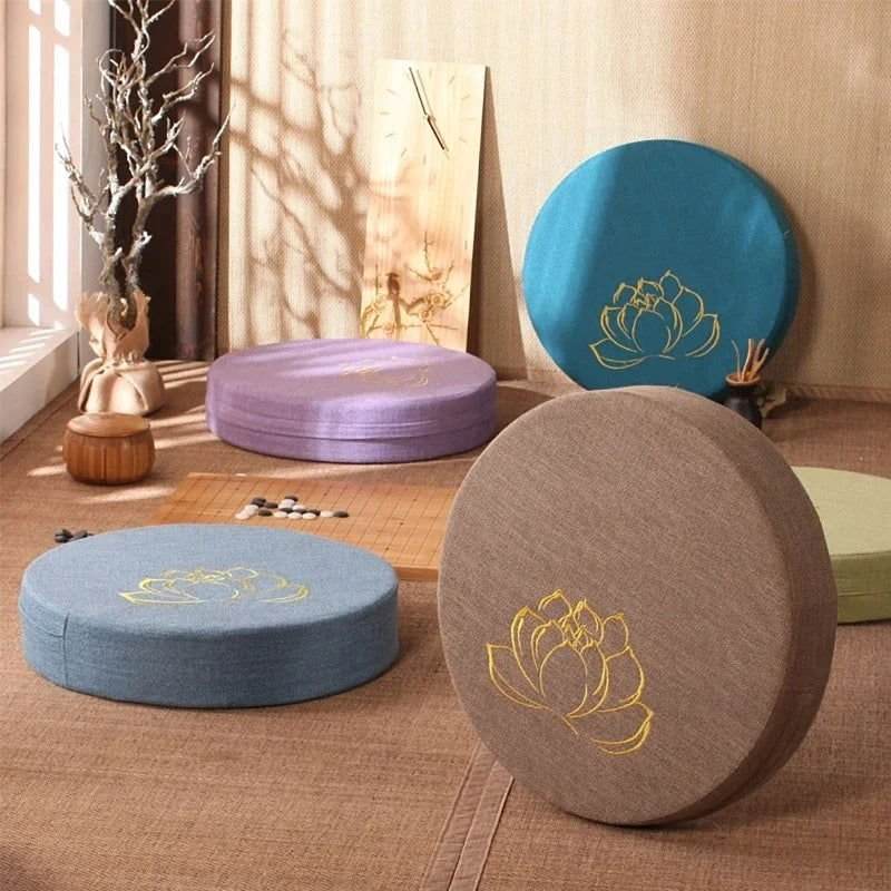 Linen Lotus embroidered meditation cushion in blue, khaki, and purple, featuring golden lotus design; round, eco-friendly, and easy-to-clean.