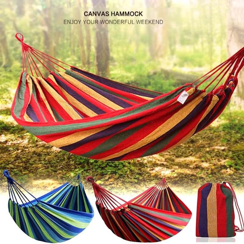 Vibrant and colorful single wide thick canvas hammock with red and blue variations, showcasing durable cotton material and portable design.