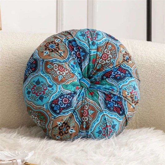 Handmade Boho round thick floor cushion with elegant center button design in a colorful pattern.