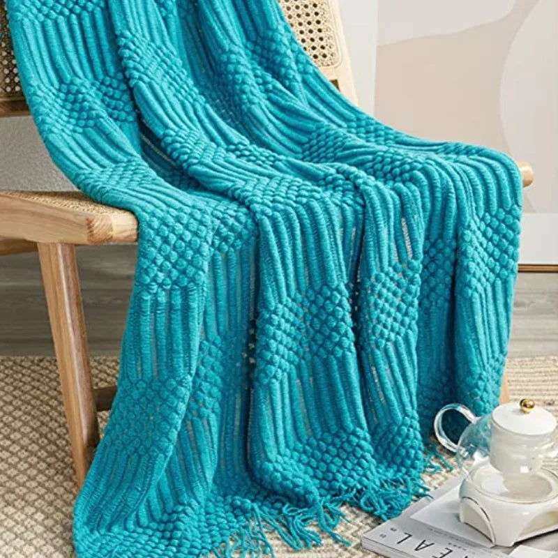 Knitted soft throw blanket with tassels, available in 10 colors.