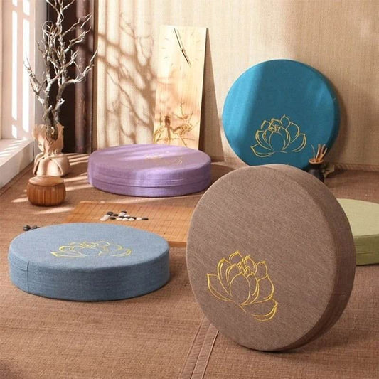 Linen Lotus embroidered meditation cushion in blue, khaki, and purple, featuring golden lotus design; round, eco-friendly, and easy-to-clean.