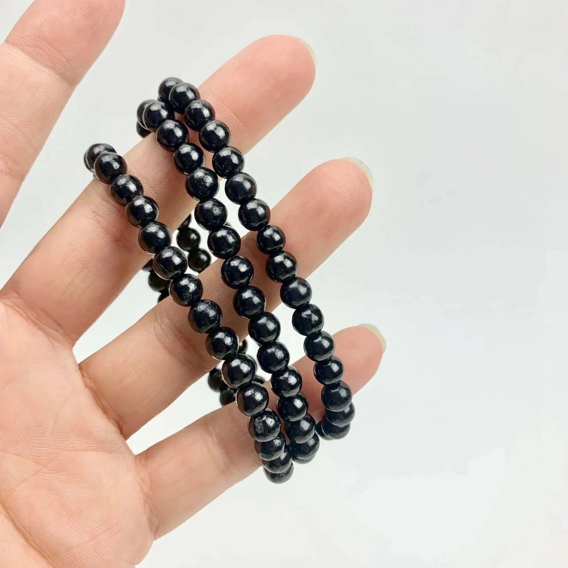 Shungite stretch bracelet with 6mm rounded beads for EMF protection.